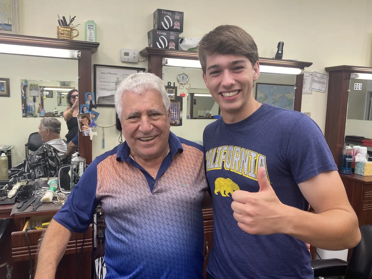 Two smiling customers inside the shop